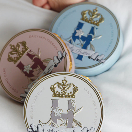 Royal Heir Botanicals tins of organic, plant-based butters with different aromatherapy support . EWG verified First Touch butter safe for babies from day 1, the next best thing to Vernix. Royal Heir Butter on Pink for the most delicate areas for baby and grown girls to help control growth of yeast on the skin, soothing and cooling for vulvoaginitis and dry vaginal burning. Royal Heir formula in Blue perfect for eczema sufferers of any age, supports the skin with Cocoa, Shea butters and Oat kernel oil